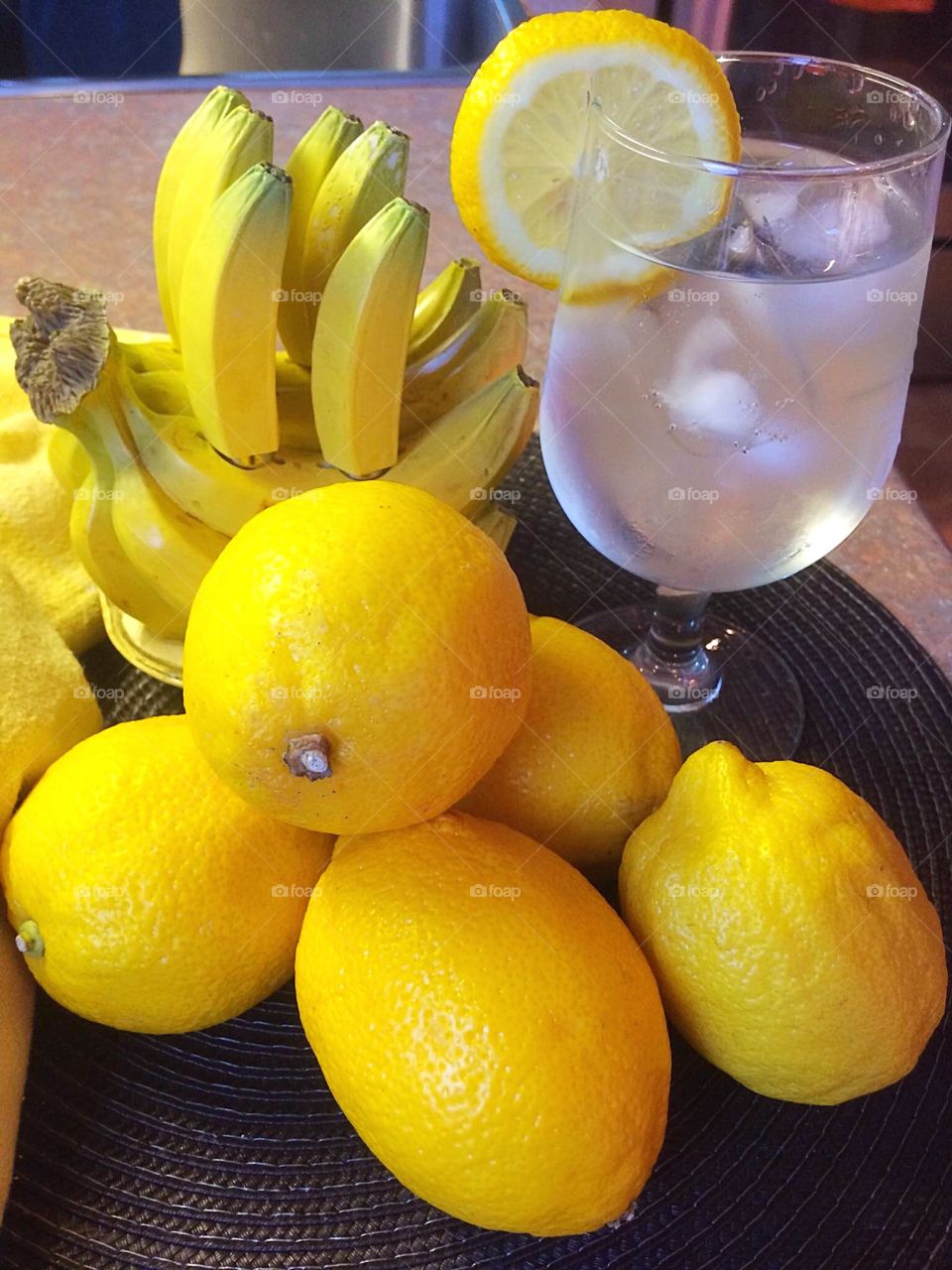 Lemon juice and lemon on table