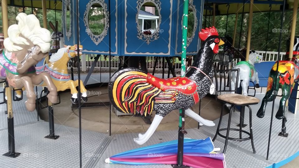 rooster on carousel. garden park, 80/90