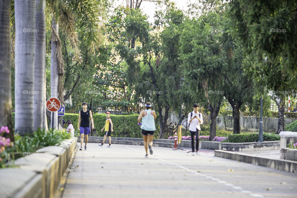 Blurry image people running exercise for health in the Benjakitti Park , Bangkok in Thailand.