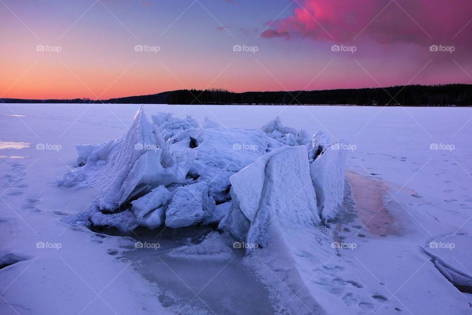 Ice formation on a lake in Western Finland. Ice formation on a lake Kulovesi in Pirkanmaa province after sunset
