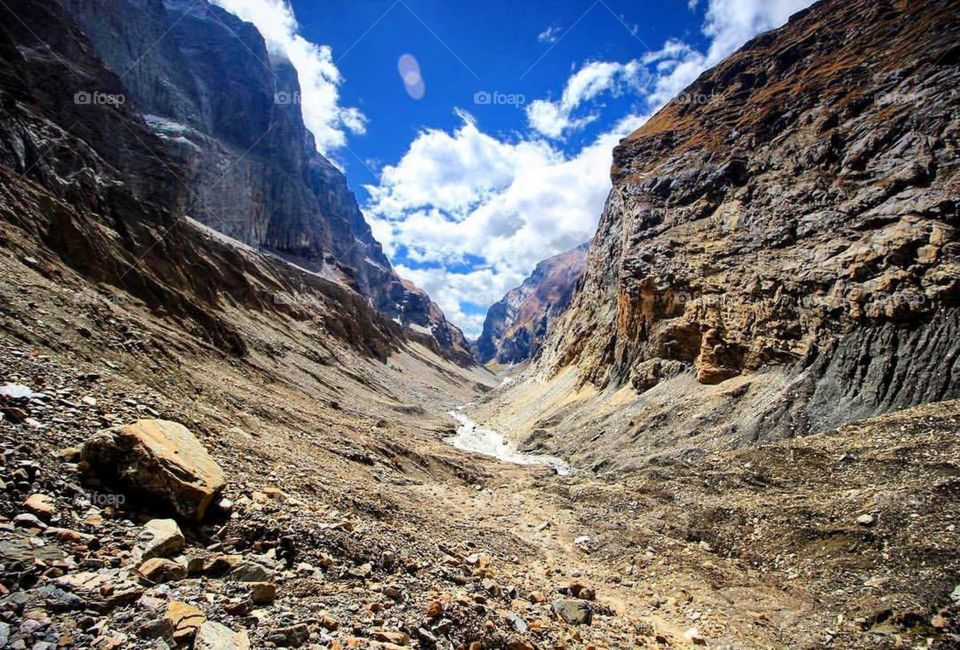 Looking back down the valley from where we had trekked from that mornin. We had to swim across the ice cold glacier river you see in the photo. An absolute adventure! Photo taken on the Dhaulagiri Circuit Trek in Nepal.
