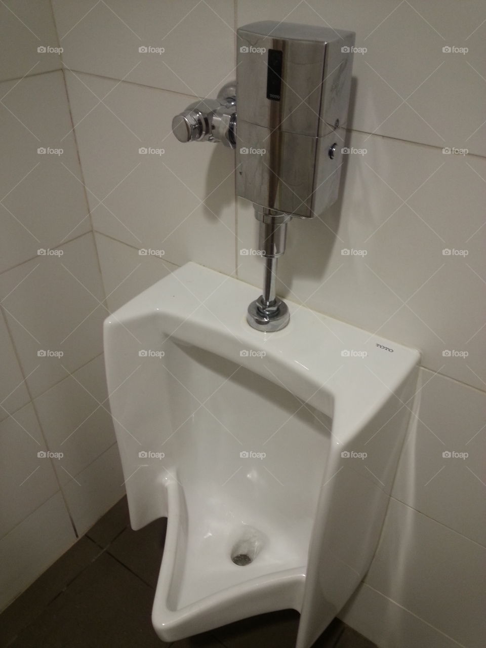 restrooms. urinal in a restroom