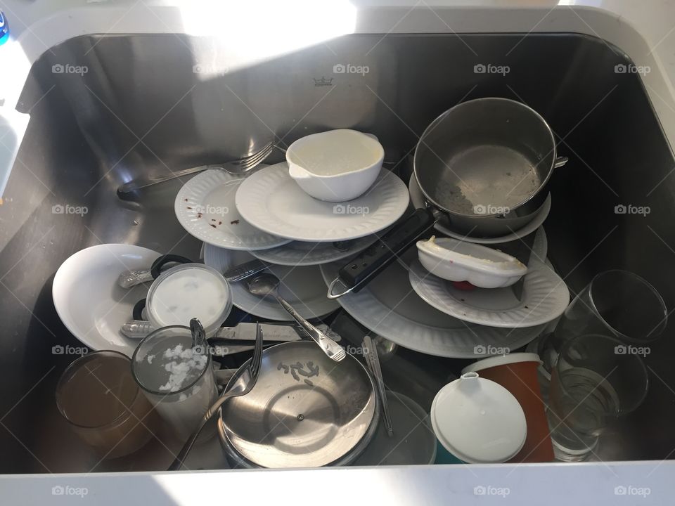 Sink full of dirty dishes