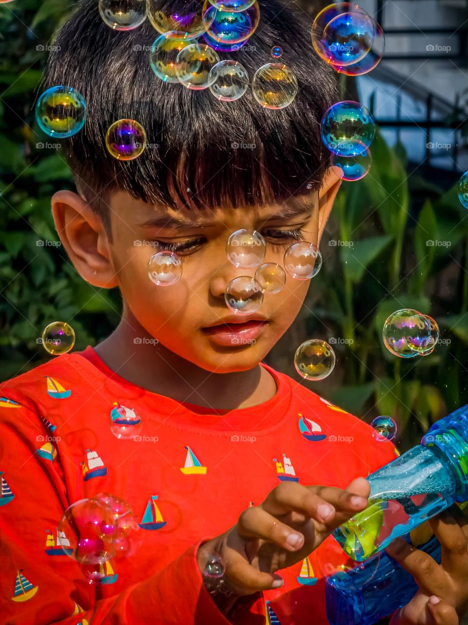 Kid playing with bubble shooter