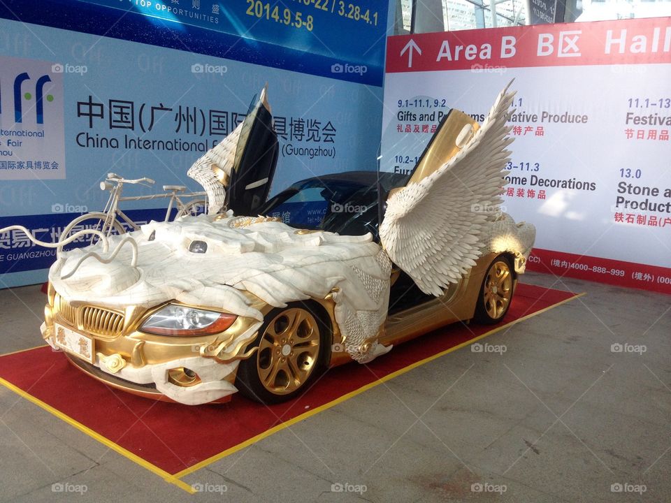 Decorated as dragon golden BMW on an exhibition in China