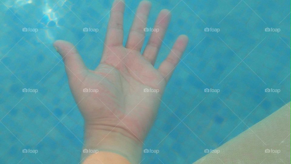 My hand under water.