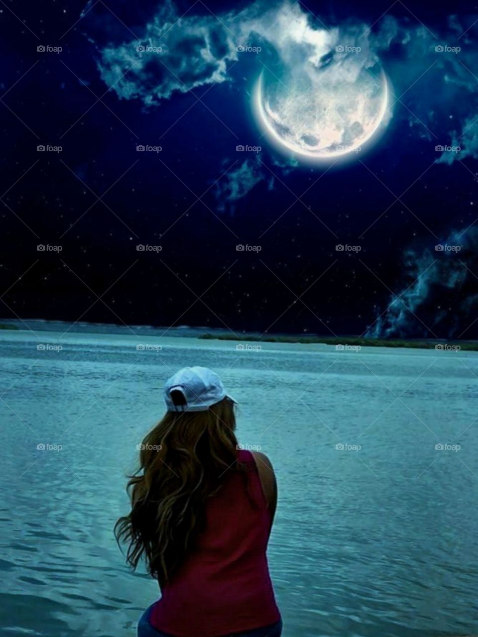 A girl looks at the moon.
