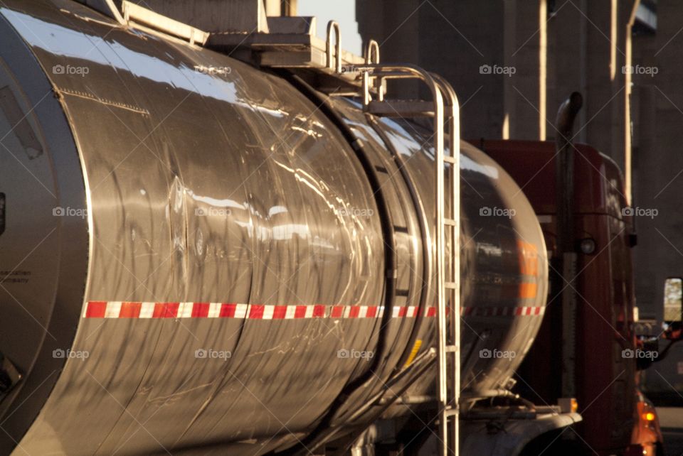 A tanker truck passes by at close range.