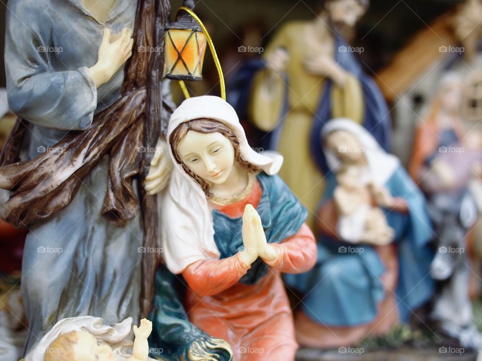 A beautiful Nativity Scene with Mary looking down on baby Jesus. 