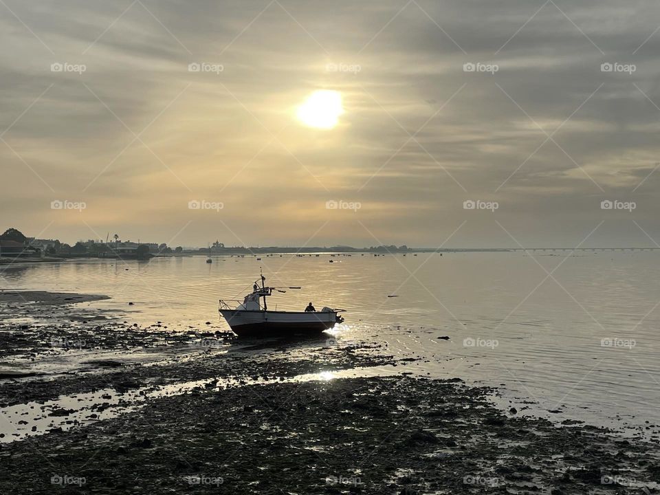 Boat on the river during sunset 