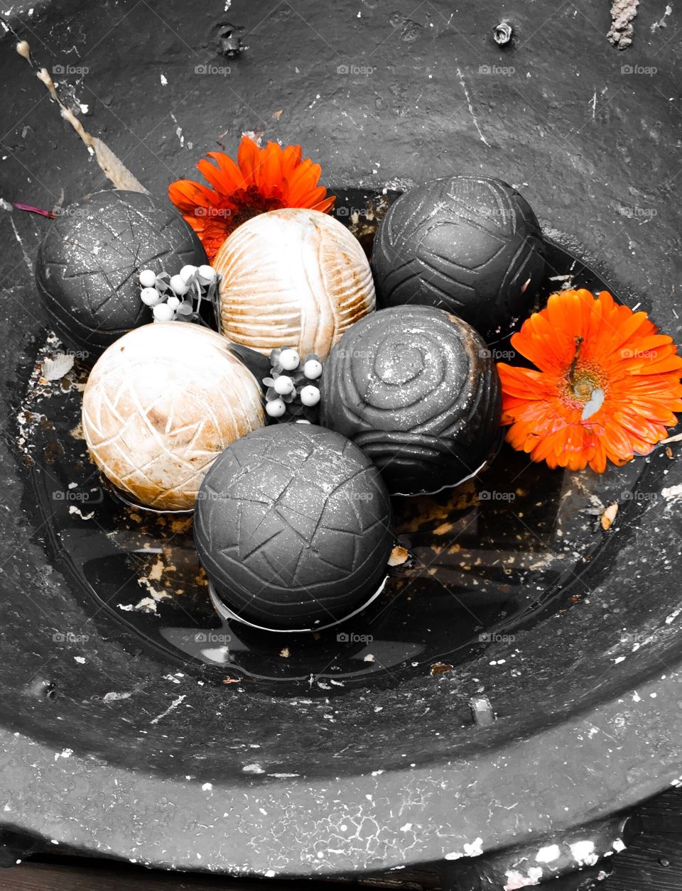 Highlighted colour flowers in photo helps what looks like bocce bald decorate an old ceramic bowl