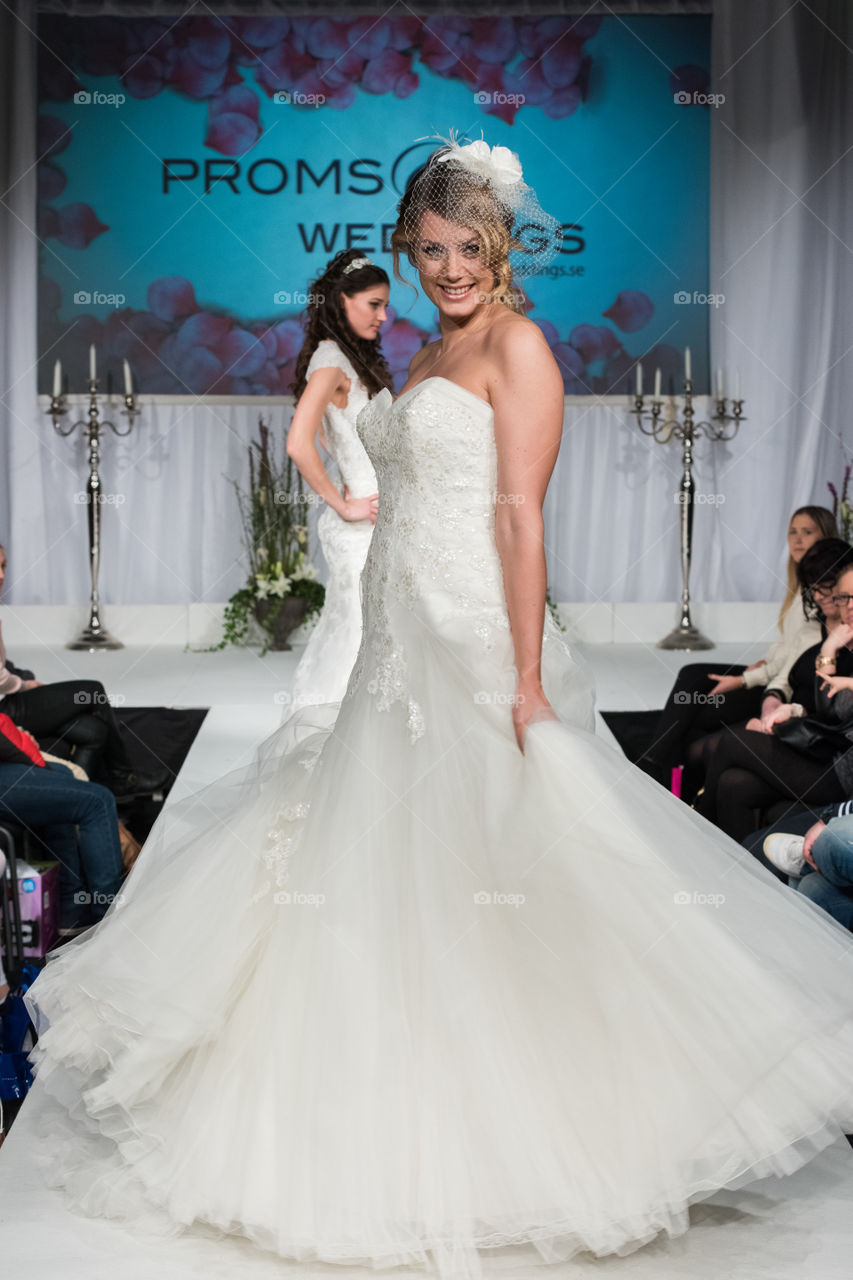 Fashion show at a wedding fair. Here are the latest dresses and clothes for both bride and groom.