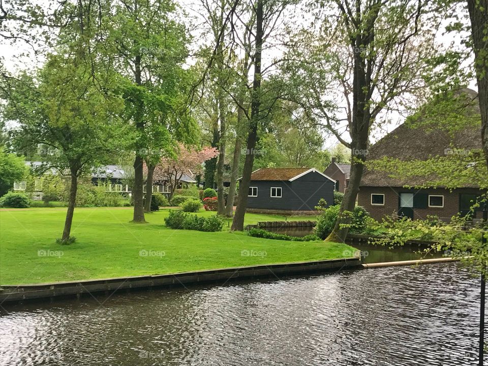 Water canal and houses in Giethoorn, Netherlands 
