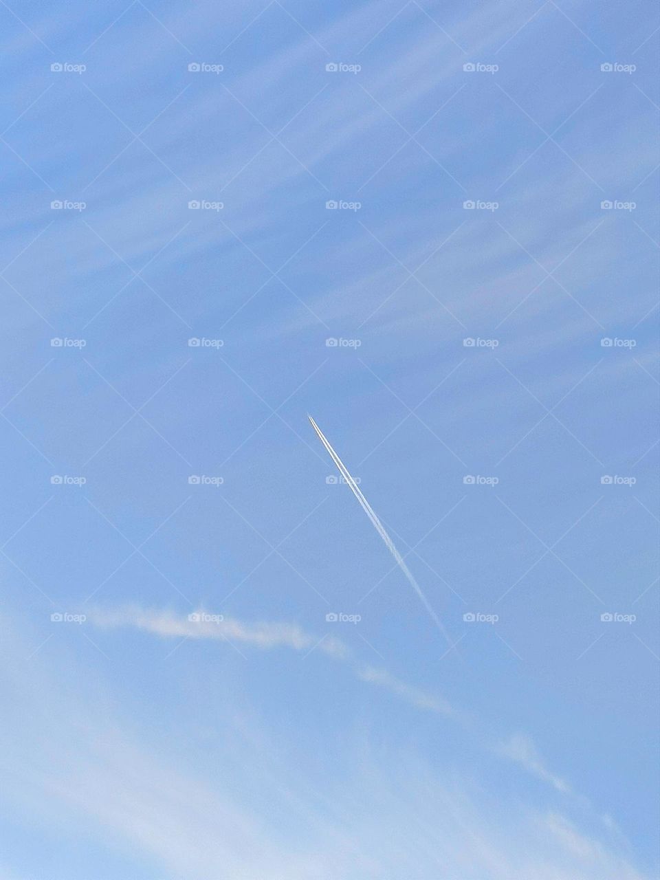 Baby blue.  In the blue sky, white gentle clouds and a plane taking off, which leaves a white stripe