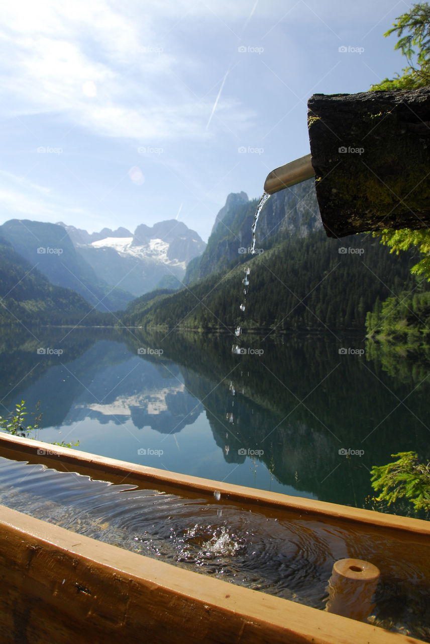 Scenic view of mountain and idyllic lake