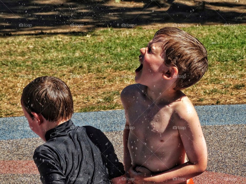 Brothers Playing In Water