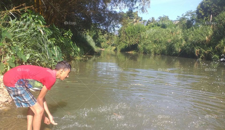 A child playing in a river