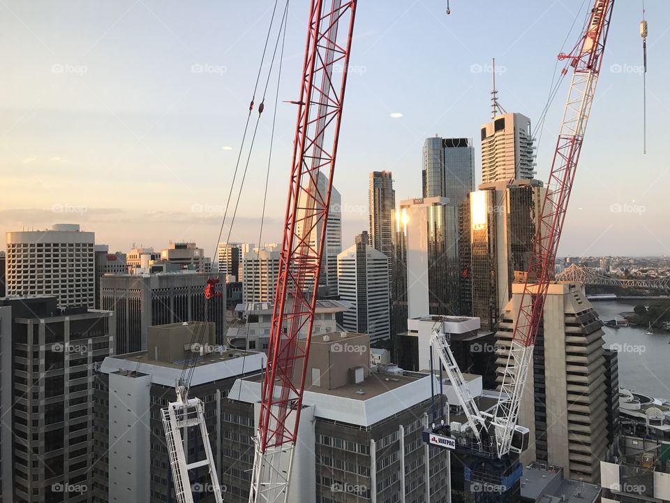 Cranes in city daylight