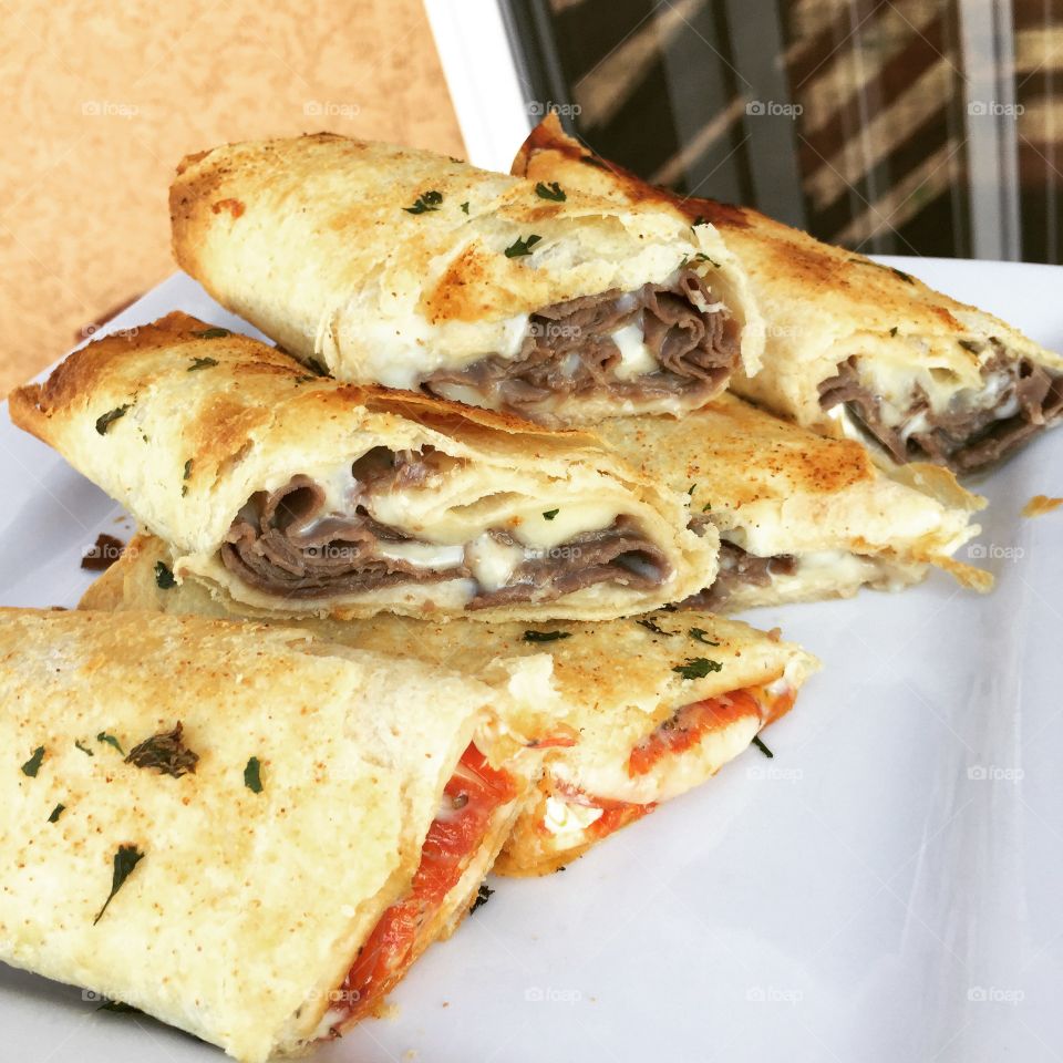 Philly Cheese Steak and pepperoni pizza wraps with a buttery flaky toasted tortilla. Along with a hit of garlic. It’ll leave you wanting more!