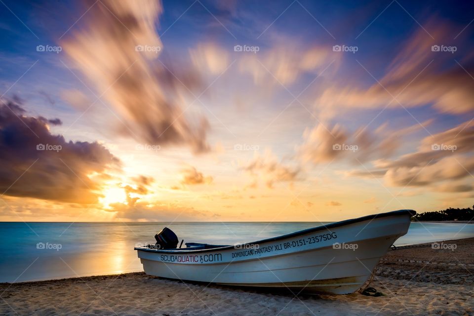 Morning sunrise and boat at beach