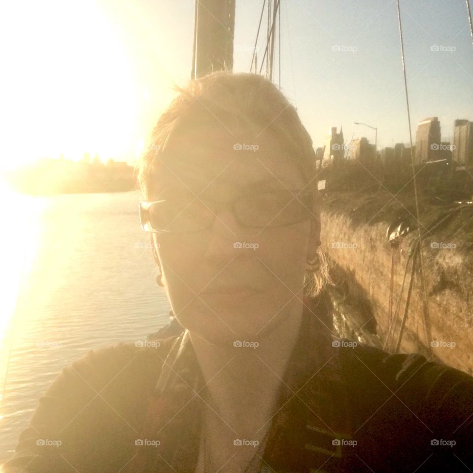 Petra photographed aboard „Salvation“, our sailboat against the golden light of the sun at dusk on a beautiful warm summertime afternoon in 2018 at Newtown Creek in Long Island City, Queens, NY. Hypnotic Productions