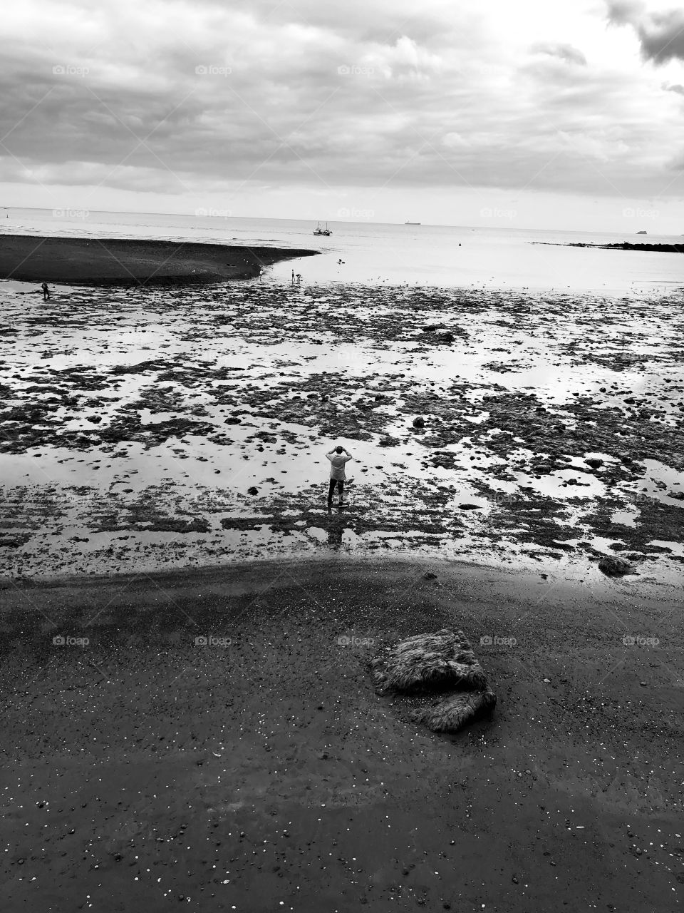 For this photo about an individual breathing life into an otherwise slightly bleak beach call, it’s rather better formed in black and white l felt, because the b and w effect captures the drama very well.
