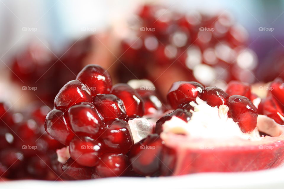 Juicy ripe pomegranate rails close-up