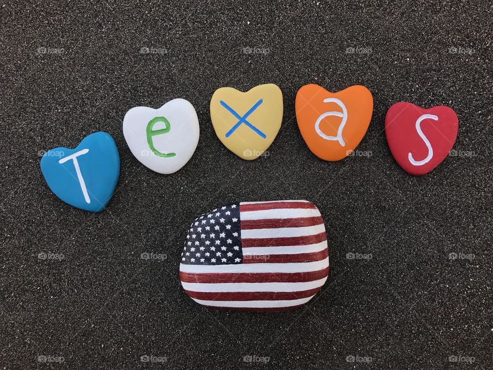 Texas State, United States of America, souvenir with colored stones over black volcanic sand