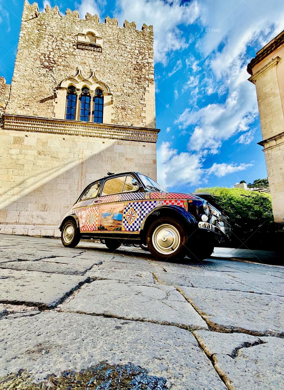 A classic Fiat 500 in the Piazza Santa Caterina in Taormina, Sicily. 