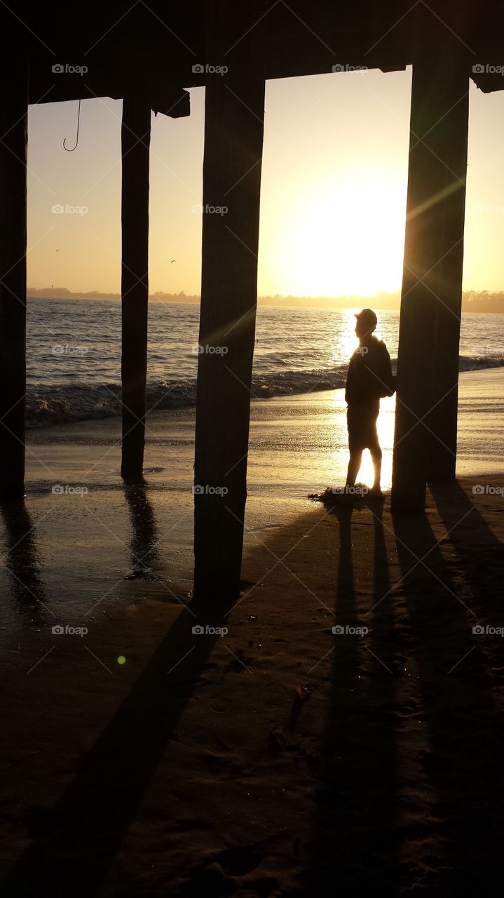 Silhouettes and a sunset on the beach