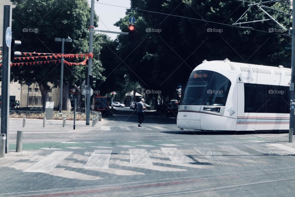 Tram cross the street