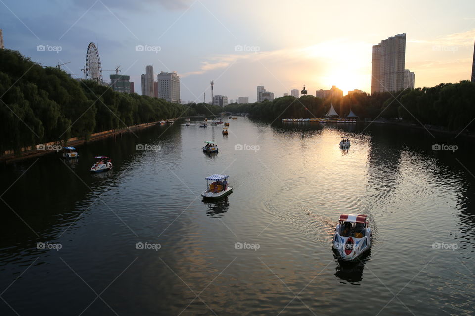 Happy time in city . People enjoying their life with their kids.warm light, warm moment,my favorite 