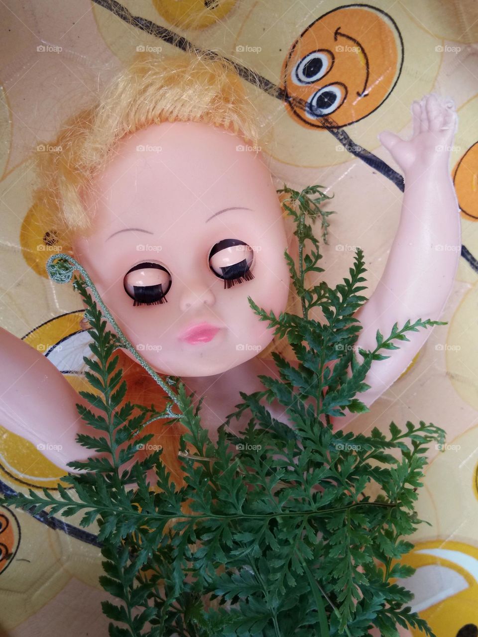 beautiful baby doll with the foliage