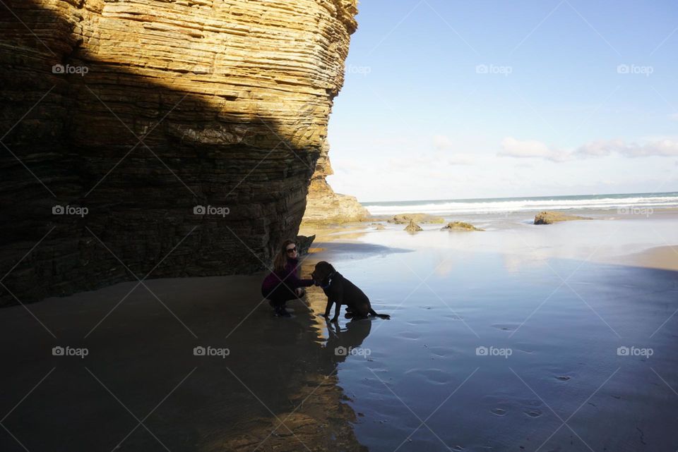 Beach#ocean#rocks#human#dog#reflect