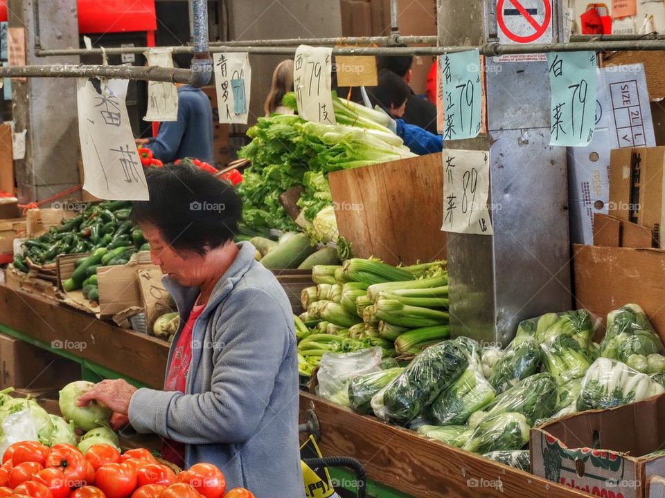 Buying Fresh Vegetables In A Chinese Grocery. Chinese Market
