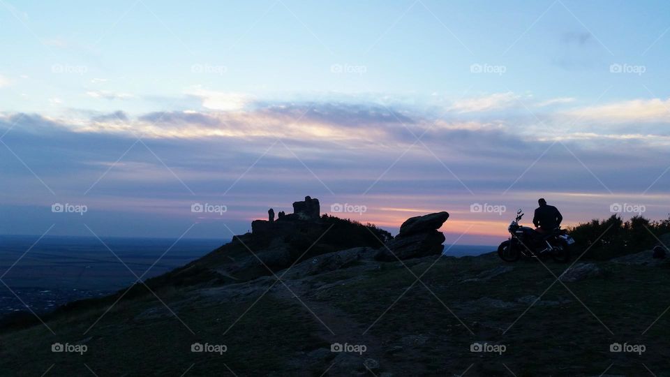 sunrise and motorcycle at Siria fortress