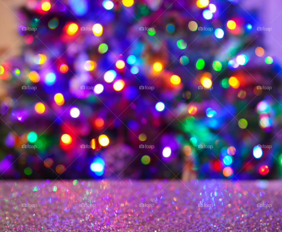Close up glitter table and Christmas tree on the background 