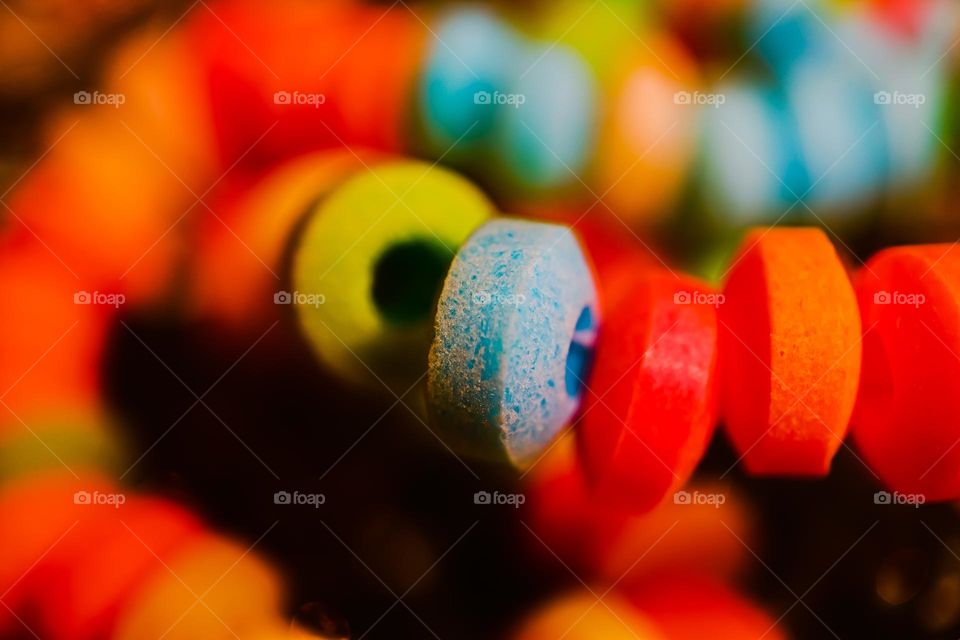 Up close and personal macro of a favorite of childhood, the colorful and delicious candy necklace , sweet and tart