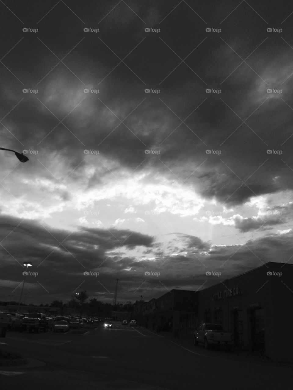 Sun & Grey in the sky simultaneously in a parking lot in Fredericksburg, VA