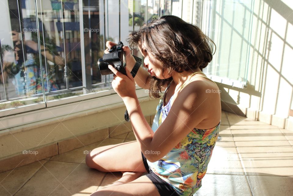 Girl photographing in natural light