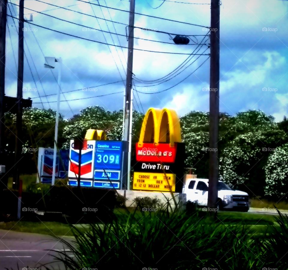 Fast paced City Life at Beltway 8 and Clay Rd ~ McDonald's on the Run Drive Thru features any item on the $1 Menu and Chevron Gas features gas at $3.09