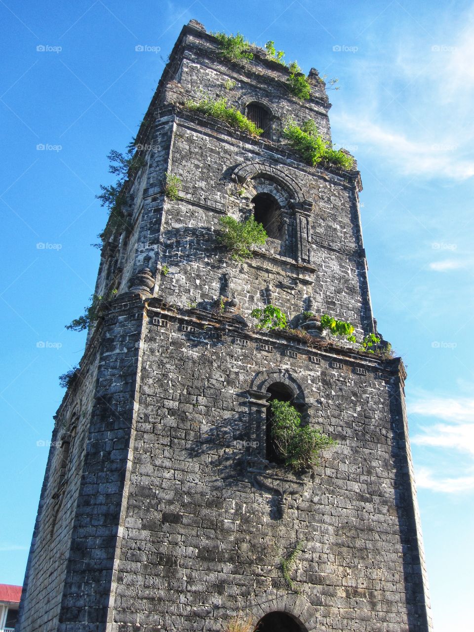 Old constantly sinking bell tower because of poor soil foundation and earthquakes, it can be found in Laoag City, Ilocos Norte, Philippines.