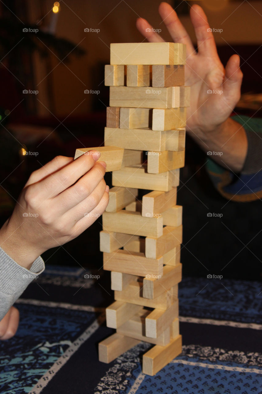 playing jenga, building tower