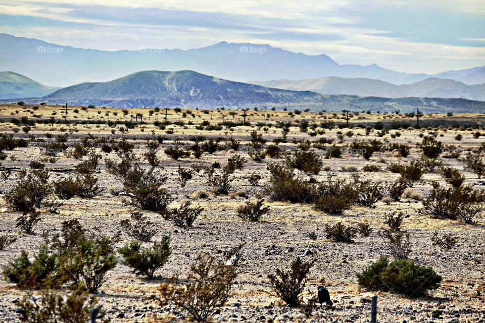 road trip landscape of the Nevada desert mountains. landmass, mountains, Cloudy Skies