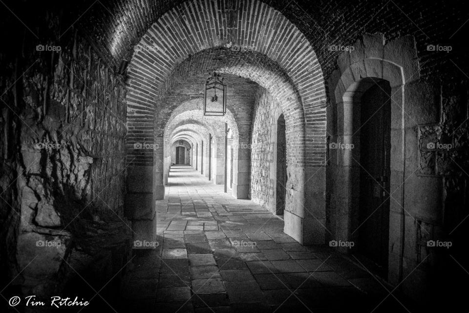 Arches and a corridor at the ancient port fort of Montjuic, Barcelona, Catalunya, Spain