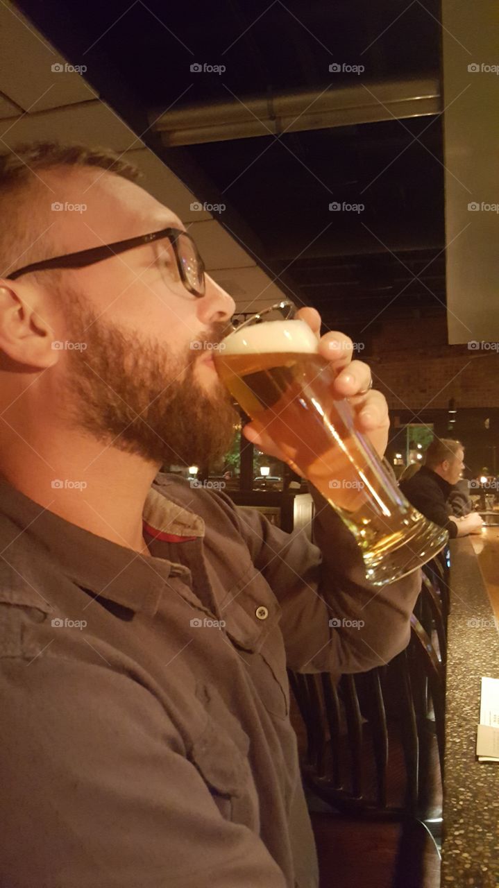 man drinking beer and loving it