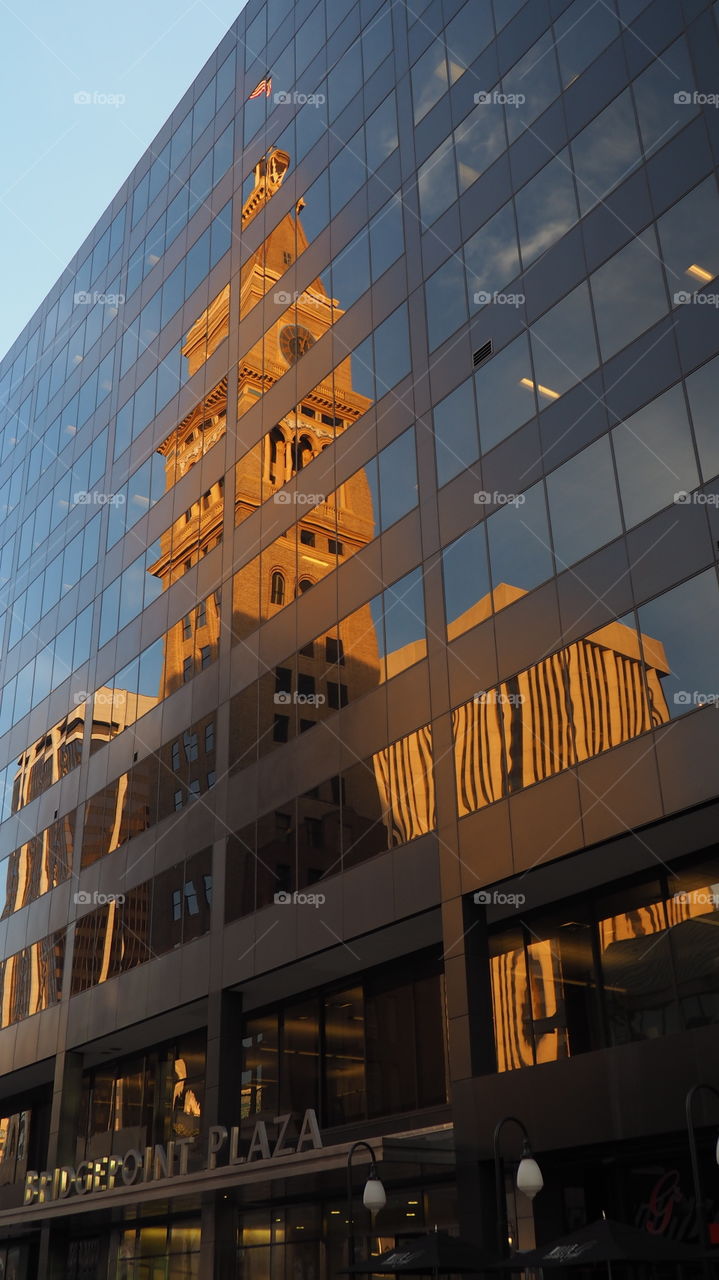 The Daniels and Fisher Tower, Denver, Co. The Daniels and Fisher tower reflects in Bridgepoint Plaza mirror façade