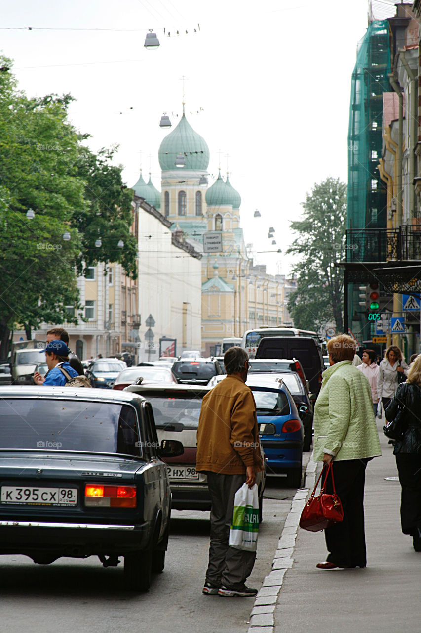 People on the street Looking at the church 