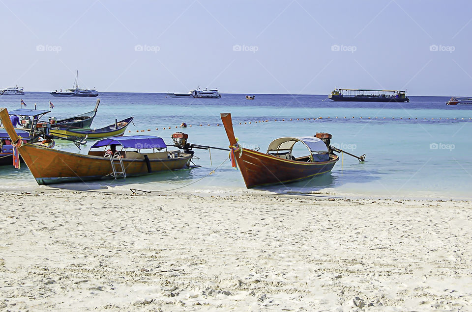 The beauty of the summer sea and the ship on the beach , Koh Lipe , Satun in Thailand.