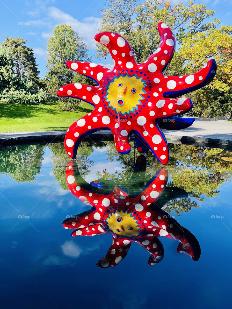 "I want to fly to the Universe "- A whimsical sculpture from the collection of the artist Yayoi Kasuma is reflected in a pool at the New York Botanical Garden. 